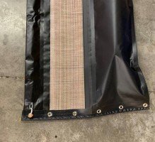 containment boom with permeable skirt